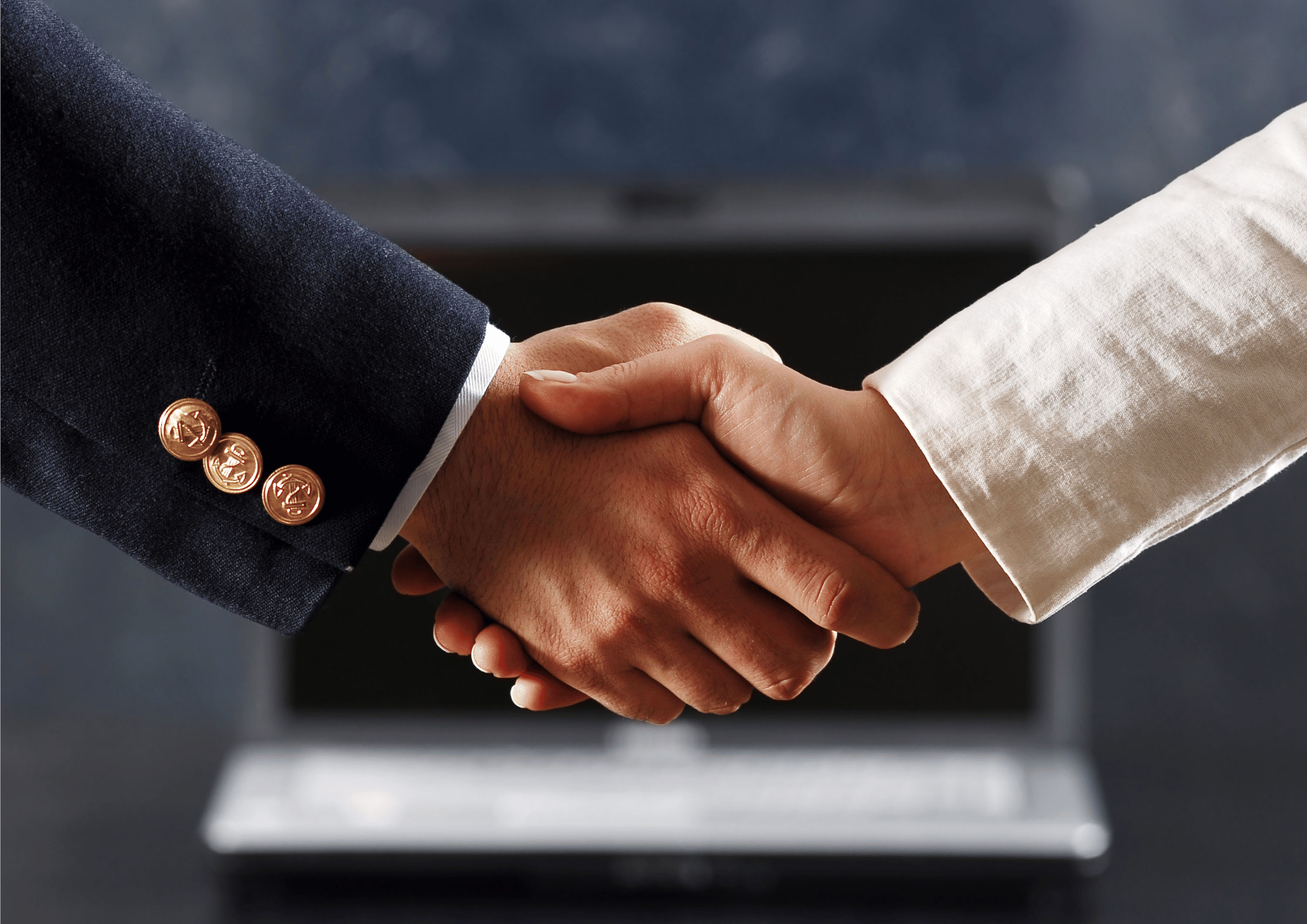 Handshake during a strategy roundtable