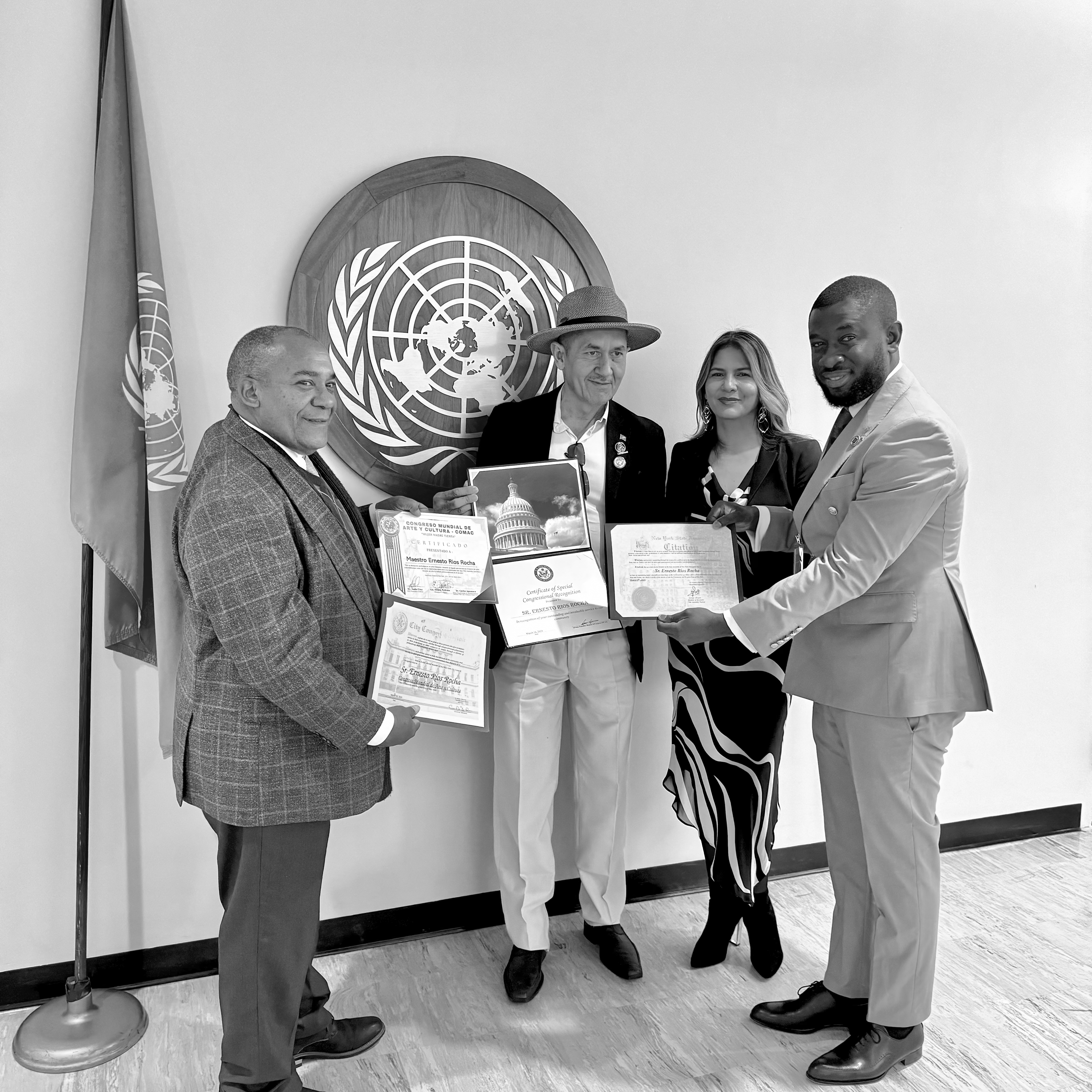 Leaders receiving recognition at an international venue